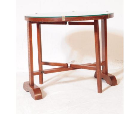 A vintage 20th century Chinese oriental camphor wood folding Chinese table. With carved detail to circular form table with gl