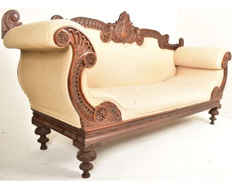 A 19th century Anglo Colonial scroll ended chaise lounge / sofa settee. The chaise having a carved mahogany frame with decora