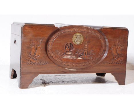 A vintage 20th century oriental Chinese carved camphor wood blanket box. Rectangular form with carved detail, brass fixing cl