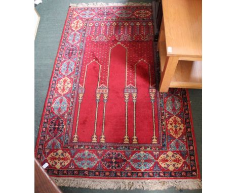 A Persian design rug, the central field having Mihrab of arches &amp; columns, fringed &amp; bordered, 163cm x 106cm