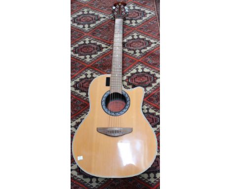 An acoustic guitar Clarissa by C L Strumente Musicale, 13#, GB300EL, together with a Stag carry case &amp; another hard shell