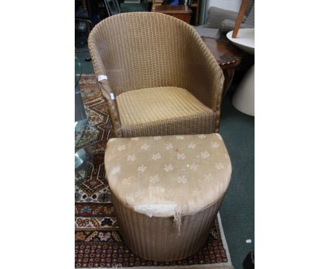 A gold painted Lloyd Loom tub chair together with laundry basket