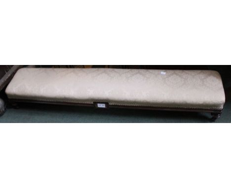 A long low upholstered foot stool together with a mahogany bed tray