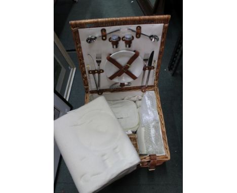 A wicker picnic hamper, fitted interior