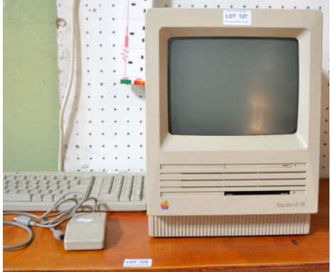 An Apple Macintosh SE model no. M5011, together with keyboard &amp; mouse