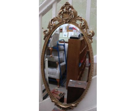 An oval bevel plated gilt wall mirror with shell &amp; acanthus leaf decoration
