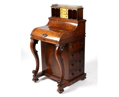 An Early Victorian Rosewood Piano Top Davenport, circa 1850, with three-quarter pierced brass gallery above a sprung mechanis