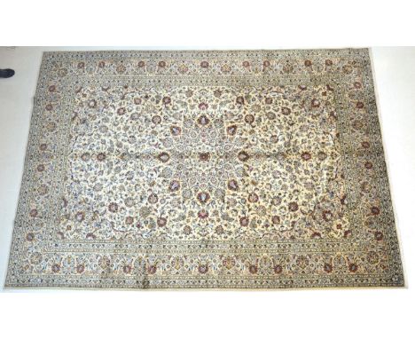 Kashan Carpet Central Iran, circa 1960 The cream field with an allover design of palmettes and scrolling vines enclosed by me