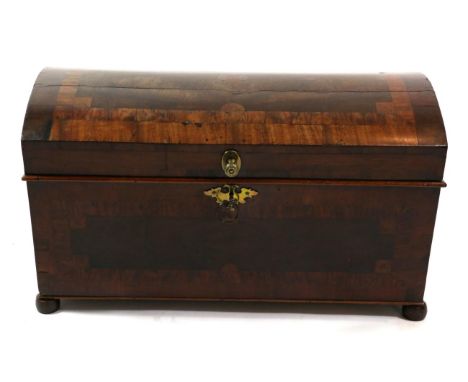 An 18th Century Pine Lined Dome Top Trunk, veneered in mahogany, burr yew and kingwood, with hinged lid enclosing a candle bo