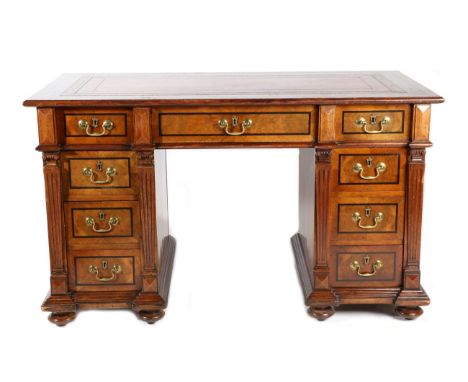 A Victorian Figured Walnut, Burr Walnut and Ebony Strung Double Pedestal Desk, 3rd quarter 19th century, with inset red and g