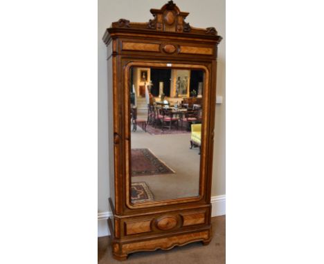 A 19th Century French Rosewood and Kingwood Armoire, circa 1850, the architectural and acanthus scrolled pediment above a cro