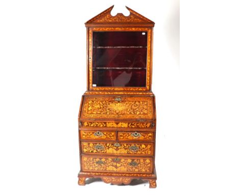 An 18th Century Dutch Walnut and Marquetry Inlaid Bureau Bookcase, the upper section with architectural pediment above a glaz