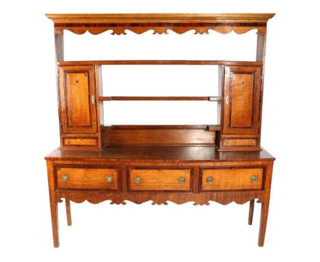 A George III Oak and Mahogany Crossbanded Dresser and Rack, early 19th century, the rack with three shelves flanked by cupboa