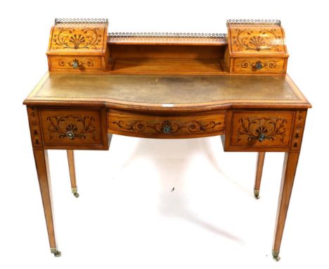 A Victorian Satinwood and Marquetry Painted Bowfront Writing Desk, late 19th century, the staged top with a pierced brass gal