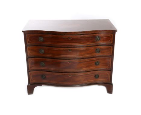 A George III Mahogany and Satinwood Banded Serpentine Dressing Chest, late 18th century, with four graduated drawers, the top