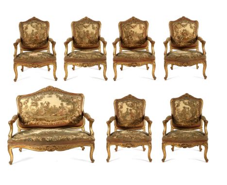 An Impressive Louis XV Style Carved Giltwood Seven Piece Salon Suite, late 19th century, upholstered in Aubusson needlework f