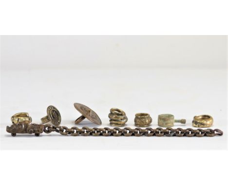 Lot (7) of Batak Sumatra bronze rings and a jewel. Each tribal ring has different characteristics,Â&nbsp;and the jewel has go