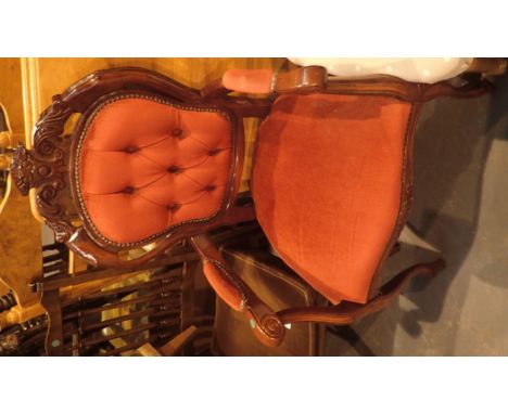 Vintage style salon chair with red upholstery and button back