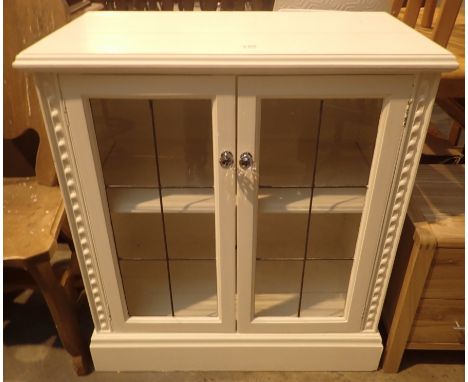 White painted pine bookcase with single shelf and twin glazed doors, L: 90 cm