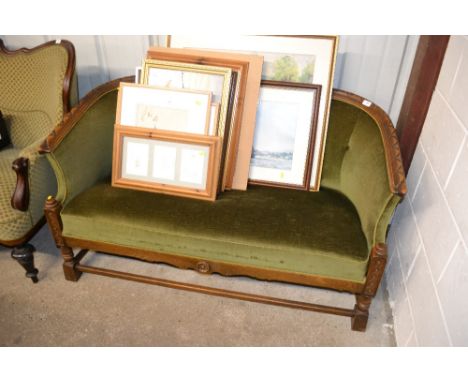 An Early 20th Century oak framed and green upholstered button back settee