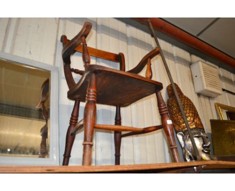 A Victorian elm seated carver chair 