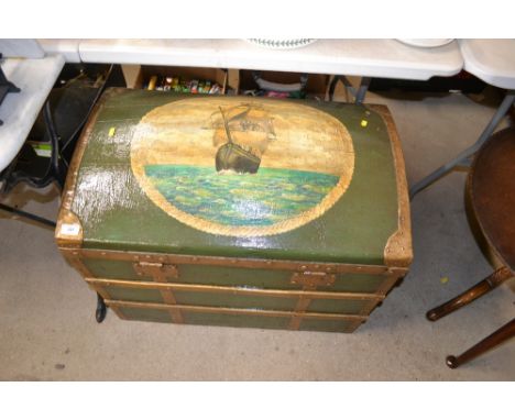 A green painted travelling trunk decorated with a sailing ship 