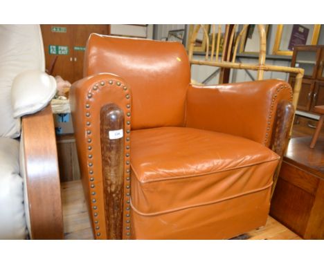 A brown leather and stud work club chair 