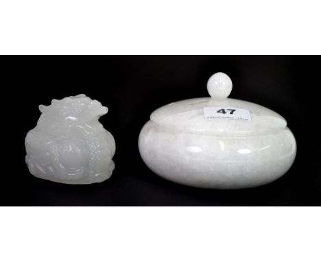 A Chinese circular white marble box and white glass (simulating jade) dragon.