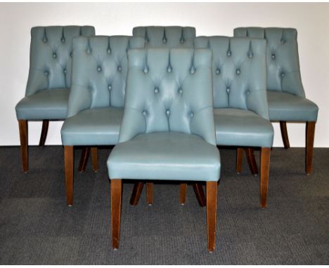 A set of 6 button backed upholstered gentlemens club chairs.