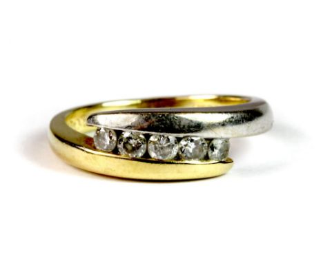 An 18ct yellow and white gold 5 stone diamond crossover ring (K).