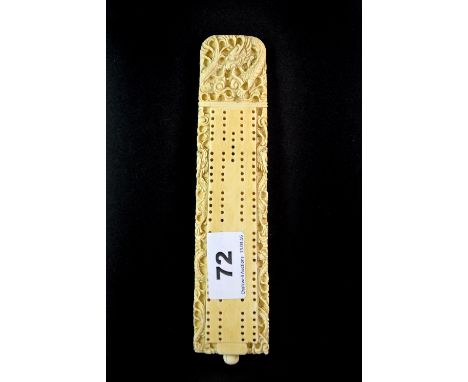 An early 20th century Chinese carved ivory cribbage board, L. 19cm.