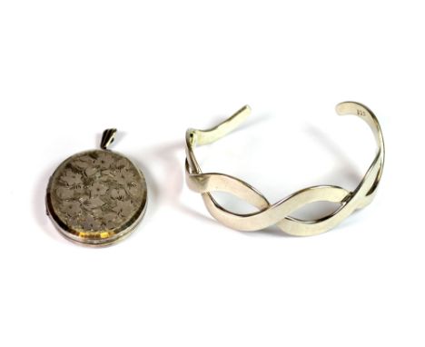 A 925 silver locket and a 935 silver bangle.