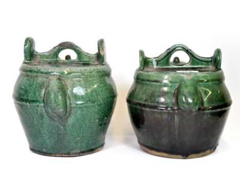 Two Chinese green glazed pottery kettles. Qing Dynasty, late 19thC. H. 21 cm.