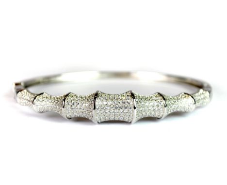 A 925 silver and stone set hinged bangle.