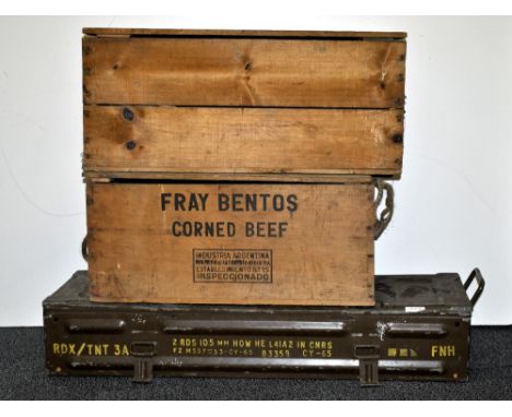 A metal ammunition trunk and two vintage wooden crates.