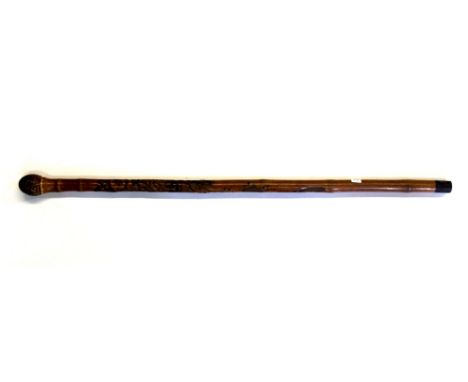 An early 20thC Japanese carved bamboo walking stick.