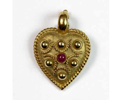 A heavy 9ct gold heart shaped pendant set with a ruby, H. 3.2cm, 7.9g approx.