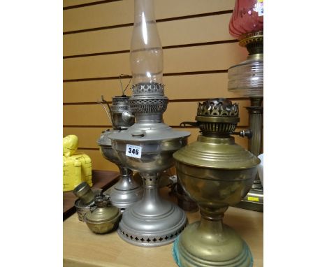 Collection of oil lamp bases together with a glass shade (for spares)