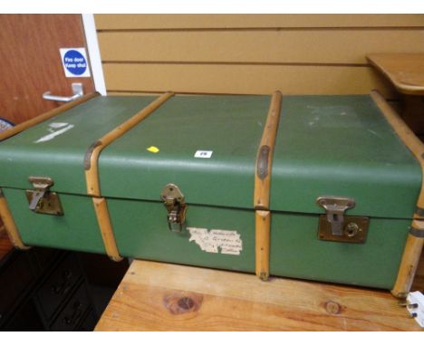 A vintage wooden banded travel trunk