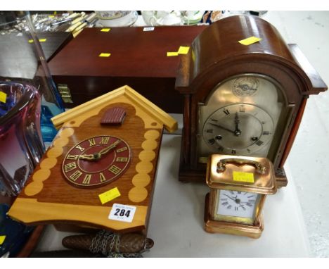 A vintage dome topped mantel clock, small copper carriage clock & cuckoo clock