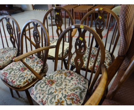 A set of six Ercol loose cushioned spindle backed kitchen chairs with Prince of Wales-style feathers (4 + 2) 
