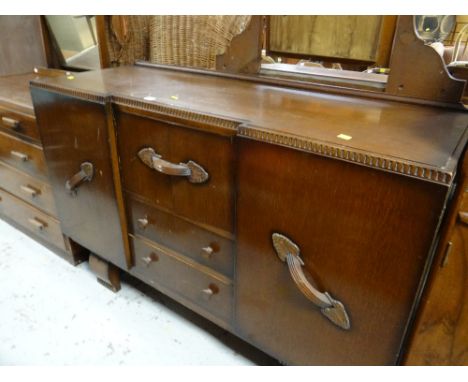 A vintage darkwood sideboard with two side cupboards and central drawers