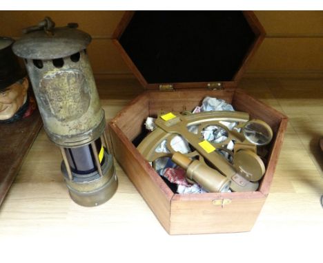 Boxed Sexton together with a blue glass miner's lamp by Hailwoods