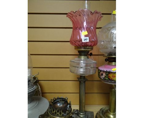 Corinthian columned clear glass reservoir & cranberry glass shade oil lamp