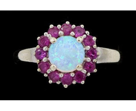 9ct gold garnet and opal cluster ring, hallmarkedCondition Report:Approx 2.25gm, size N, head diameter = 12mm