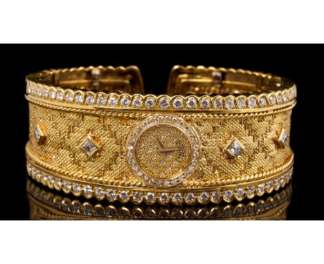 Fine Etoile gold (18ct) and diamond set bracelet watch, the wide hinged cuff with circular pavé set diamond dial with diamond