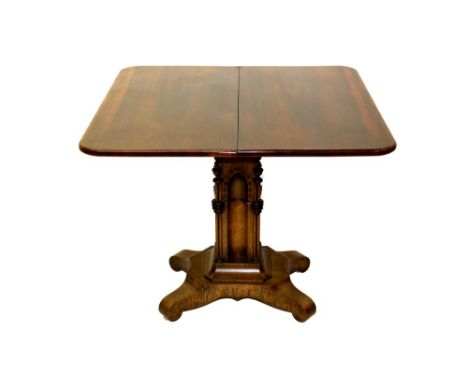 Good George IV rosewood tea table in the Gothic style, round rectangular fold-over top above concave frieze, raised on archit
