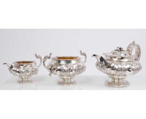 Fine quality George IV silver three piece tea set - comprising teapot of compressed melon form, with panels of raised foliate