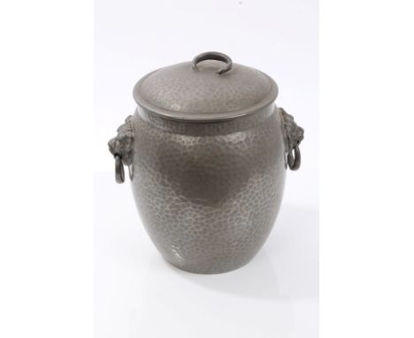 Early 20th century Tudric pewter biscuit barrel and cover of swollen cylindrical form, with flanking lion mask ring handles a