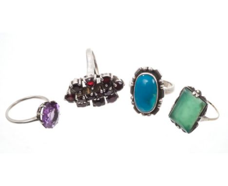 Four dress rings - to include faux alexandrite ring, garnet cluster ring, Art Deco green stone ring and one other   CONDITION